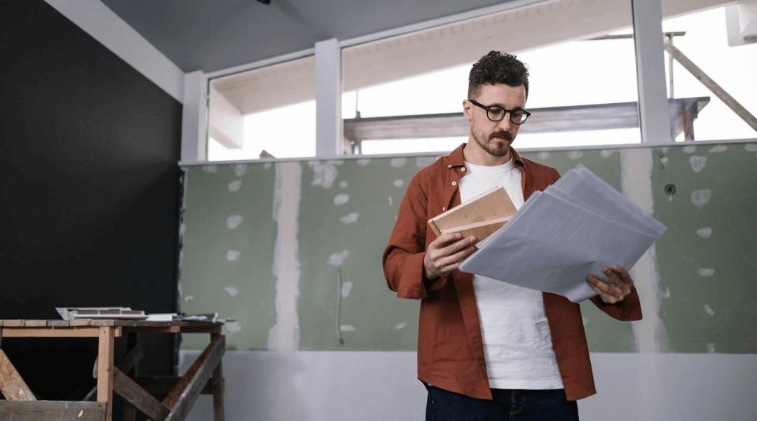 Contractor reviewing home remodel plans for kitchen and bathroom renovation in Denver Colorado
